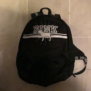 PINK backpack with rhinestone details. Large backpack that has lots of pockets.